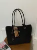 Bolso de mano tejido de alta gama retro transfronterizo, bolso de hombro simple casual moderno, bolso de axila de gran capacidad para ir al trabajo