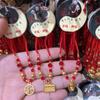 Nueva pulsera de cuerda roja retráctil extraíble colgante dorado estilo étnico cuerda de mano tejida a mano pequeño regalo tienda de 2 yuanes