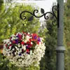 Cesta colgante de hierro forjado estilo europeo transfronterizo, soporte para flores de pared, estante colgante para flores, soporte para macetas, carillón de viento, soporte para farola