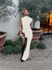 Moda feminina europeia e americana verão 2026 novo estilo: vestido justo, gola redonda, franzido, colado ao corpo, assimétrico, sem mangas para mulheres