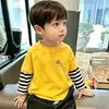 Camiseta de manga larga de dos piezas de imitación para niños, nuevo modelo de principios de otoño 2026, top de algodón puro para primavera y otoño, camiseta interior para niños mayores