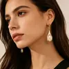 Pendientes de fábrica transfronterizos estilo retro lágrima piedra ojo de gato, lujo ligero, alta gama, diseño de nicho, pendientes, tachuelas, al por mayor en stock