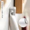 Clip de gancho blanco sin costuras estilo japonés para baño, clip adhesivo fuerte para limpiador facial y pasta de dientes