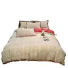 Juego de ropa de cama de cuatro piezas de gasa doble, fresco y sencillo, popular en línea, funda de edredón de encaje de algodón puro, falda de cama, colcha jacquard teñida en hilo, estilo sábana ajustable