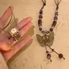 Collar Colgante de Campana de Mariposa de Cerámica Estilo Étnico Retro para Mujer, Nuevo Accesorio de Cadena Larga para Suéter de Moda