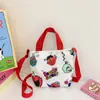 En la nueva bolsa de lona ins 2024 más vendida coreana casual para niños bolsa de hombro bandolera fabricantes al por mayor