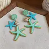 Pendientes de botón de estrella de mar de plata de ley con resina estilo resort costero Pendientes simples y de moda Diseño de pendientes elegante y versátil Nicho