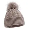 Novos estilos de outono e inverno de gorros infantis de tricô trançado, disponíveis na Amazon para vendas transfronteiriças, em cores sólidas com pompons, proporcionando calor e proteção contra o vento