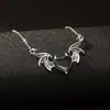 Collar de alas de diablo de comercio exterior transfronterizo estilo gótico retro punk hip-hop colgante de metal con forma de corazón gota de aceite