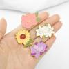 Broche de flor de comercio exterior nuevo, temperamento, lirio, girasol, gota de aceite, broche de pintura, hebilla anti-luz, venta al por mayor