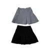 Falda corta plisada de estilo universitario para niñas en verano, elegante, de color liso, cintura elástica, versátil, anti-exposición, media falda, ropa para niños