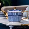 Juego de taza y platillo de café de porcelana de hueso de estilo británico, tetera con flores para el té de la tarde británico, taza de desayuno de cerámica pintada de azul y dorado.