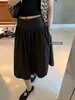 'Falda de Ballet Relajada' - Un estilo ligero, casual y relajado con una cintura ancha y un dobladillo elegante y voluminoso, falda de longitud media