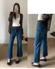 Otoño TOP estilo europeo Guangzhou Línea Trece jeans acampanados cropped con abertura trasera elásticos 360 grados con cinturón 9192