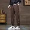 Calça de Veludo Cotelê Masculina Outono Inverno Afunilada Calça Jogger Masculina Calça Jogger Listrada Solta Casual Versátil Harem Calça Longa