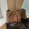 Bolso 2026 nuevo bolso tote para la escuela y el trabajo, bolso de hombro versátil de gran capacidad para estudiantes universitarias, transfronterizo