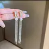 Material de cobre con baño de oro real, pendientes largos con borla de pedrería brillante, elegantes y modernos, hacen que el rostro parezca más delgado, pendientes de mujer a la moda y versátiles