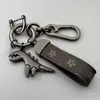 Chaveiro de Dinossauro Fofo Desenho Animado Pingente de Metal Estilo Casal para Carro Masculino Chaveiro de Corda de Couro de Alta Qualidade para Pendurar na Cintura