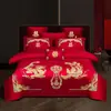 Juego de ropa de cama de lujo estilo chino, hecho de algodón 100% de fibra larga, un juego de cuatro piezas que incluye una sábana y una funda de edredón de algodón puro rojo, perfecto para la alcoba de una recién casada.