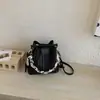 Bolso tipo cubo de alta apariencia 2026 Verano Nuevo de Moda Bolso Cruzado de Cadena Nicho Estilo Relajado Bolso de Mano de Color Sólido