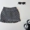Saia Plissada de Lã com Bolinhas Estilo Coreano para Meninas de Outono, Saia Estilosa para Bebês Anti-Exposição em Forma de Botão