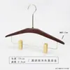 Percha para pantalones de madera maciza en color nogal negro, especialmente para tiendas de ropa, para uso doméstico y de hotel, sin marcas, antideslizante, percha con pinza de madera para pantalones al por mayor