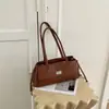 Bolso acolchado tipo Chanel para debajo del brazo, nuevo y moderno de la colección primavera-verano 2026, bolso baguette de alta gama vintage, bolso de mano para hombro para mujer
