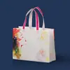 Fabricante Venta al por Mayor Bolsas Laminadas Gruesas No Tejidas en Stock, Bolsas de Compras para Empaque de Ropa Impresas a Color, Bolsas Tote Plegables