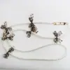 Comercio exterior venta caliente cadena de mariposa de cadena de perla de imitación ABS cadena universal para teléfono móvil llavero cordón de lazo anti-pérdida