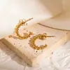 Aretes de acero de titanio del fabricante, aretes grandes de aro de acero inoxidable exagerados, diseño geométrico liso hueco, populares en Europa y América, aretes de nicho