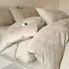 Juego de ropa de cama de cuatro piezas jacquard de algodón de fibra larga de Xinjiang de alta gama, funda de edredón de satén de algodón puro, sábana plana, sábana ajustable