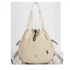Atacado Transfronteiriço 2026 Primavera/Verão Nova Bolsa de Mão com Múltiplos Bolsos de Grande Capacidade Bolsa de Ombro Mochila Bolsa Feminina Bolsa de Tecido