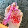Llavero creativo de aceite de rosa lindo con arena movediza líquida pequeño colgante accesorios para bolso amantes pequeños regalos al por mayor