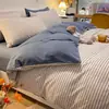 Juego de cuatro piezas de algodón puro lavado estilo pijama color nude amigable con la piel sábana de cama ins funda de edredón juego de ropa de cama para dormitorio estilo fresco sábana bajera juego de tres piezas