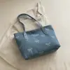 Nova bolsa tote de lona da moda 2026 para mulheres, estilo casual e doce com um laço, grande capacidade, pode ser carregada na mão ou usada como bolsa de ombro
