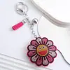 Novo chaveiro de girassol sorridente europeu e americano pingente de bolsa de couro com strass pequenos acessórios de presente fabricantes atacado