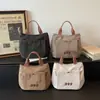 Bolsa de Lona com Letra Bordada para Mulheres Modelo 2025 Bolsa para Trabalho, Deslocamento, Almoço Bolsa de Mão Versátil Bolsa Tote Casual para Mulheres