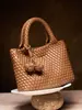 Bolso nuevo tejido a mano, bolso casual de hombro y cruzado, versátil para ir al trabajo, bolso tote pequeño, bolso de mano de nicho de alta gama