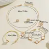 Set de joyería europeo y americano transfronterizo, collar con diseño de trébol de cuatro hojas geométrico con goteo de aceite, aretes y pulsera versátiles y elegantes