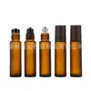 Venta al por mayor de frascos roll-on de vidrio esmerilado de color ámbar de 10 ml con tapas de aspecto de madera, adecuados para dispensar té, aceites esenciales y perfumes; estas botellas están diseñadas para proteger el contenido de la luz