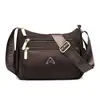 Bolsa de Tecido de Nylon Leve Repelente à Água Bolsa Transversal Casual para o Dia a Dia Novo Estilo Bolsa Simples de Bolinho Bolsa de Ombro Feminina da Moda