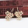 Pendientes de aguja con forma de flor de circón y diseño de rayo dorado de color cobre bañado en oro de Yiwu, hechos a mano, B2452