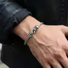 Pulsera de acero de titanio con calavera de personalidad dominante de AliExpress, pulsera retro gótica de doble calavera con alambre de acero al por mayor