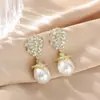 Pendientes de botón de perla con forma de lágrima de circón chapados en oro real Pendientes de estilo retro francés de corte Pendientes de lujo ligero de alta gama para mujer