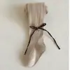Leggings Infantis Outono 2026 Roupas Externas Malha Meia-calça para Meninas Longa Listrada Laço Pequeno Médio Crianças Meias de Bebê
