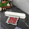 Máquina de sellado al vacío transfronteriza máquina de envasado por bombeo de alimentos snacks frescos secos y húmedos embalaje de plástico doméstico pequeña automática compresión