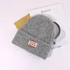 Chapéu de Lã Feminino Quente de Inverno Tricotado para Ciclismo Estudante Proteção para Orelhas Chapéu Frio Estilo Coreano Mais Fácil de Combinar Chapéu de Lã com Aplicação