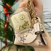 Llavero de oro puro 999, bolsa pequeña de cuero, bolsa de la suerte, colgante popular Shuibei de buena suerte y fortuna, regalo de vacaciones al por mayor