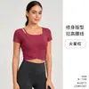 Nuevo estilo de top de yoga asimétrico cruzado con sujetador incorporado, ajuste ceñido, adecuado para Pilates, fitness y entrenamientos, de manga corta, para mujer
