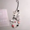 Cordón para Funda de Teléfono de Cerámica con Cuentas Estilo Cartoon Ins con un Toque de Alta Gama y Encanto de Cámara Ccd Lindo